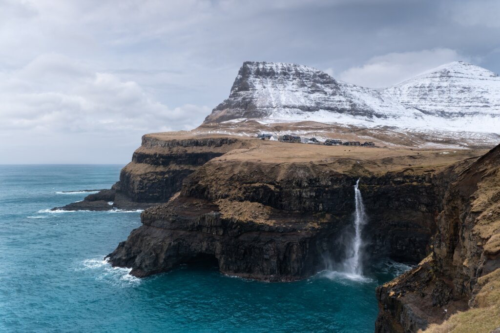 A,Village,And,A,Waterfall,In,The,Faroe,Islands,In