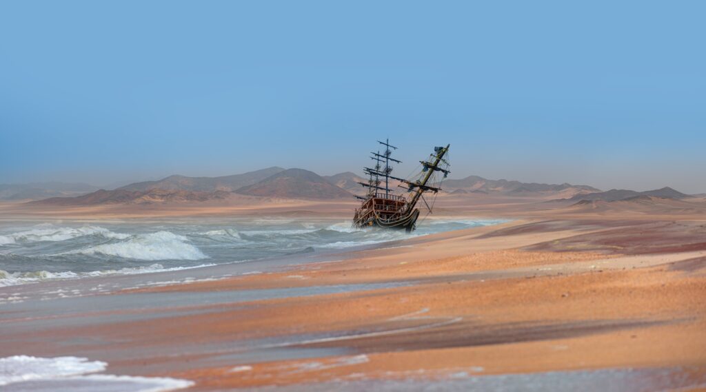 Verroest schip op het strand van de Skeleton Coast waar de Atlantische Oceaan Namibië ontmoet – ruige kust met Christoffel Travel